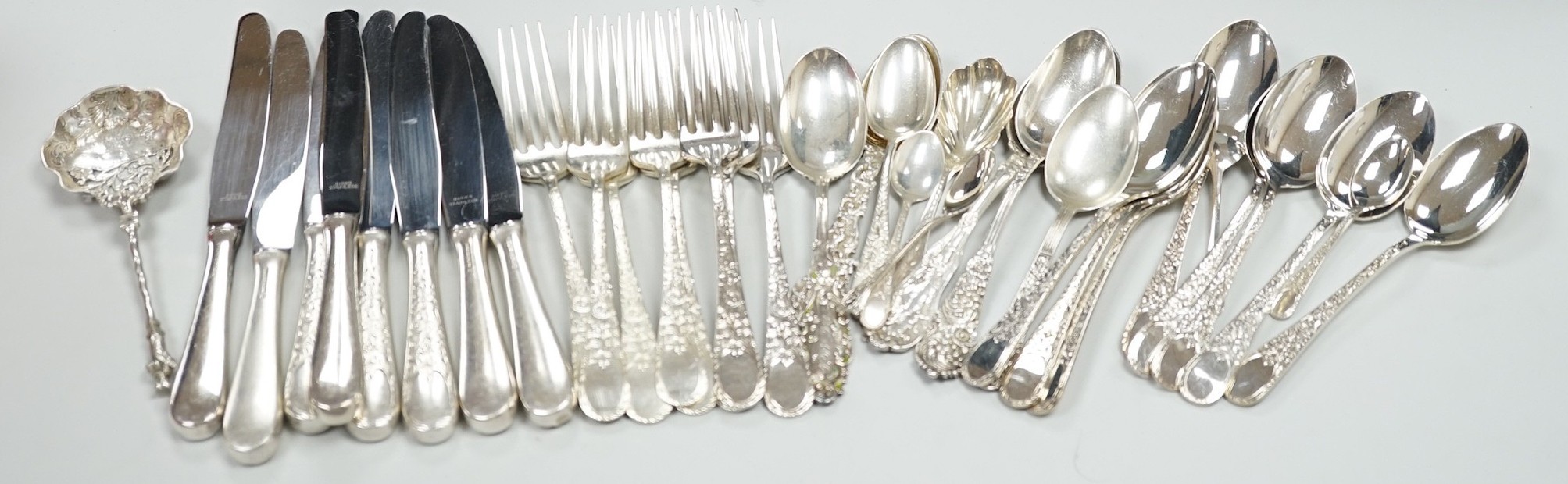 Five Canadian Birks sterling table forks, one sterling teaspoon and six sterling handled table knives, together with seven items of sterling flatware, a Hanau white metal ornate spoon and fifteen items of Birks Regency p
